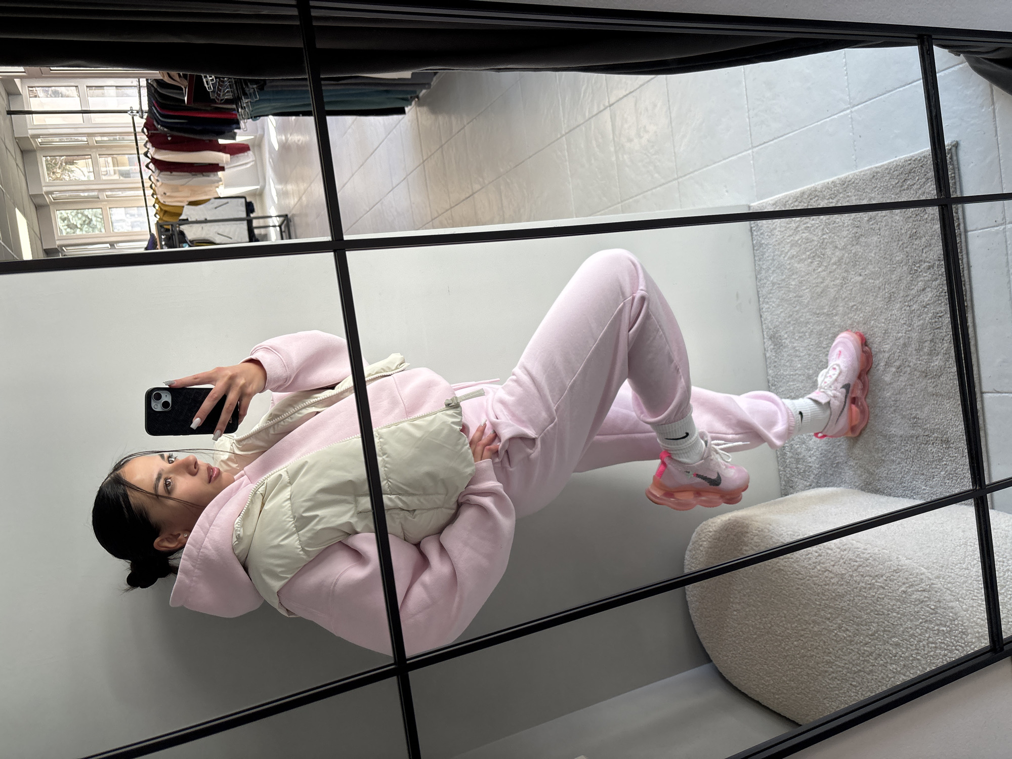 Woman takes mirror selfies, enjoys cupcake in Gabrovo morning