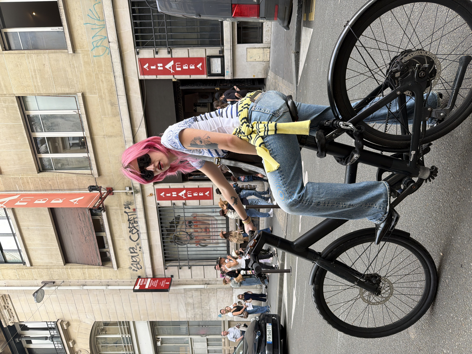 Pink-haired cyclist spotted riding through Paris streets