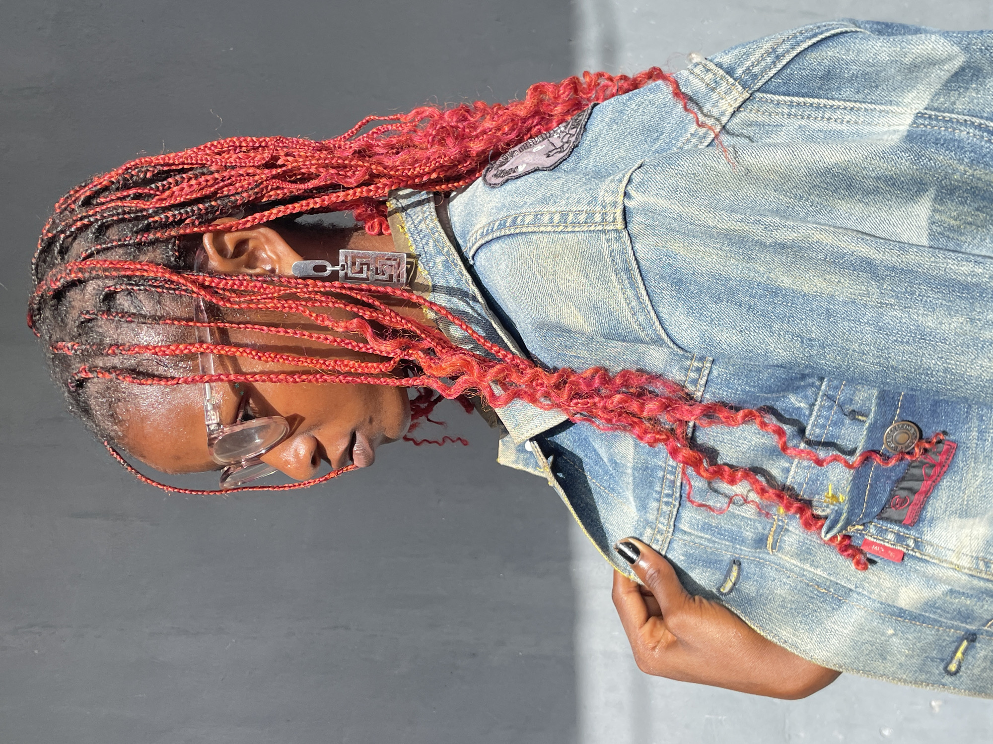 Portrait session documented in Badagry featuring woman with red braids
