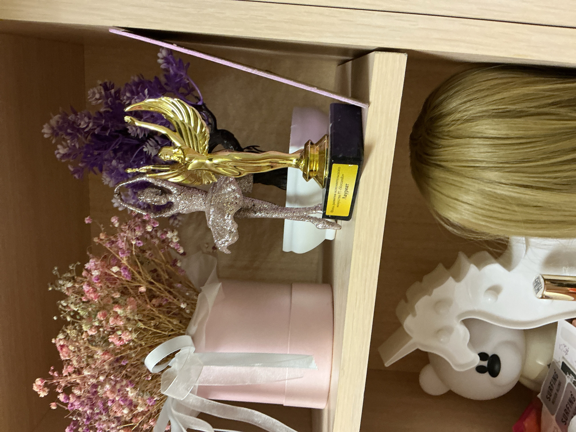 Residential interior documented with shelves, curtains, and decorative items