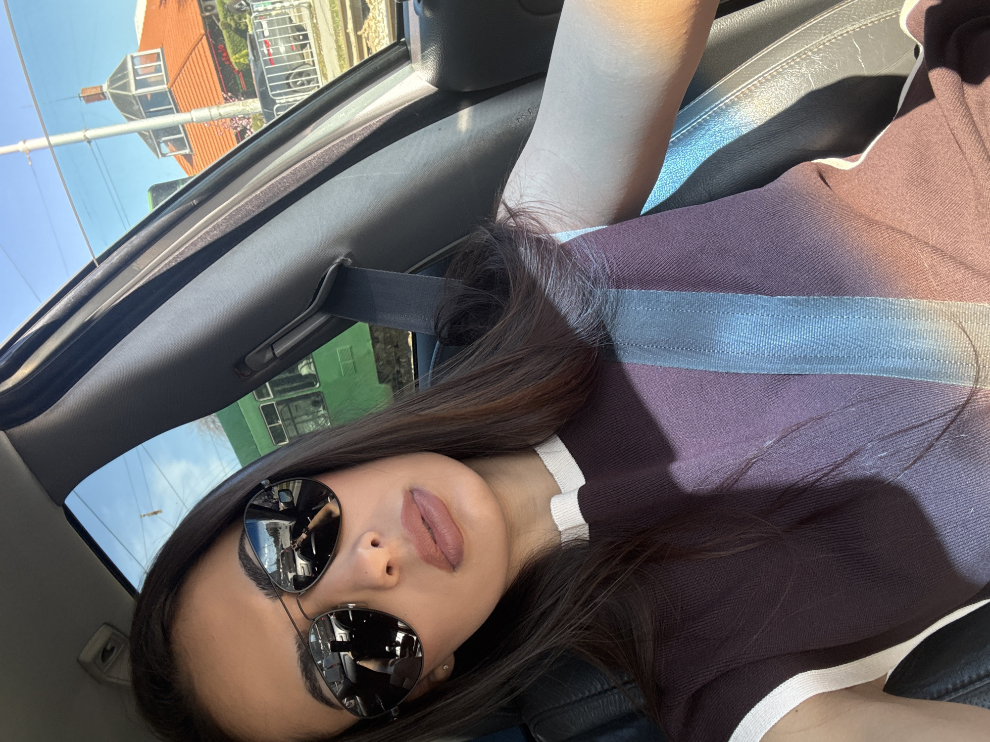 Woman in sunglasses observed in car in Sofia