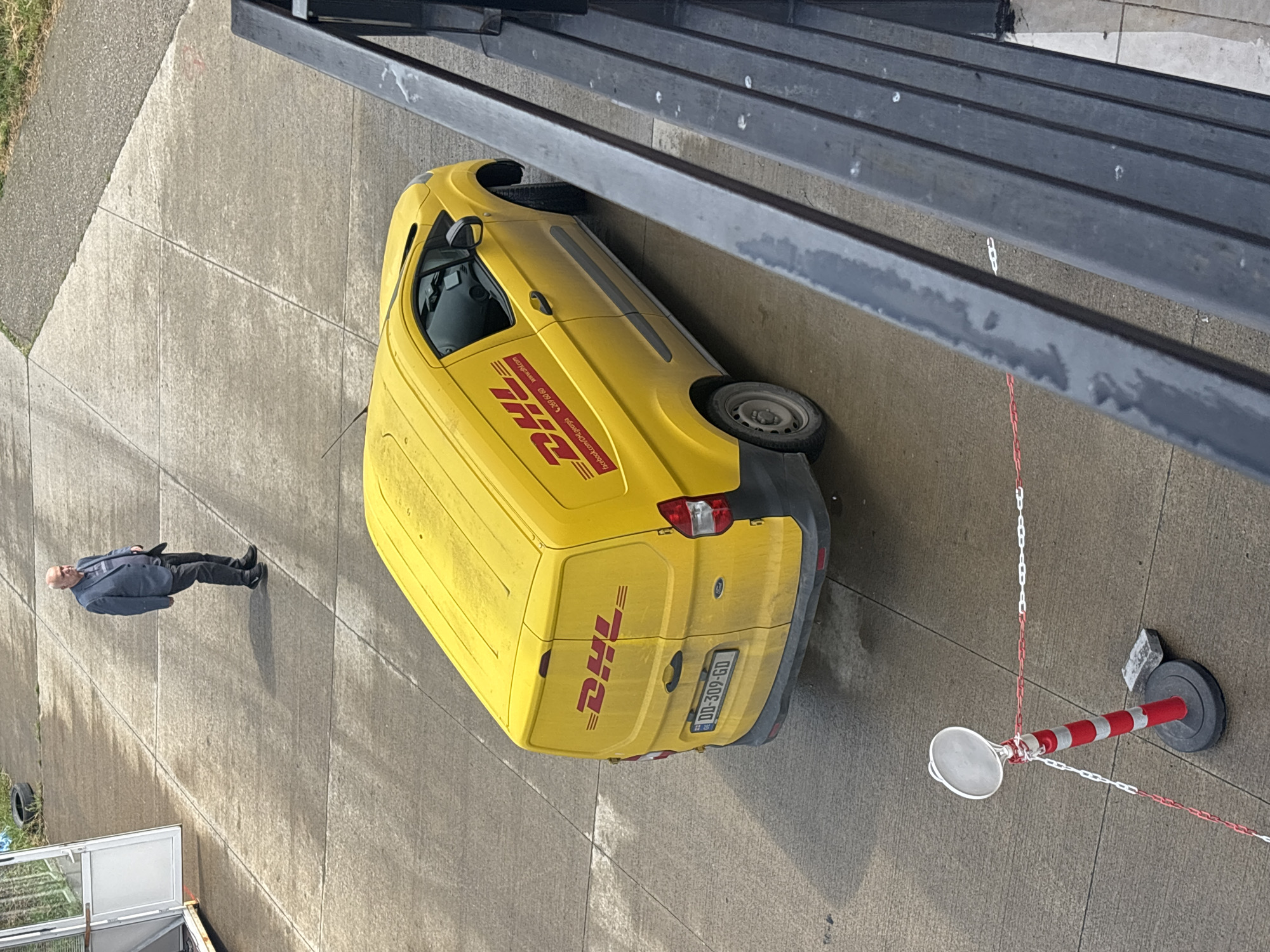 DHL delivery van departs Tbilisi parking area