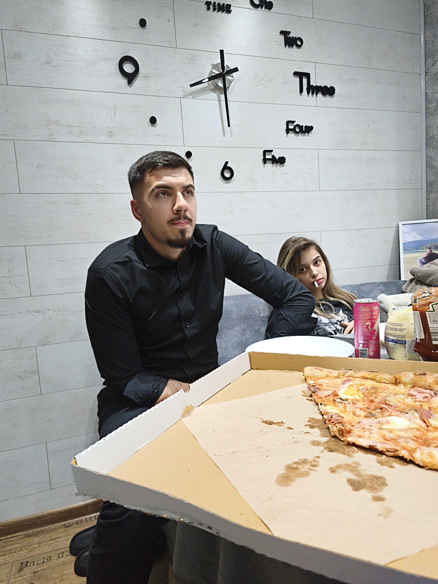 Couple shares casual meal with pizza and beer in Pleven