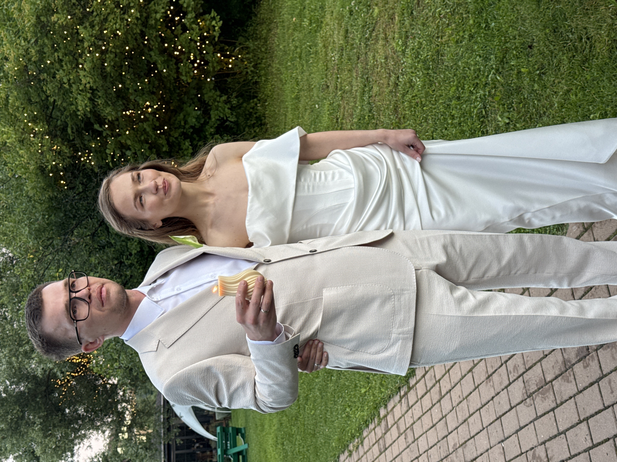 Outdoor wedding celebration with rustic decor and candlelit cake, Khimki