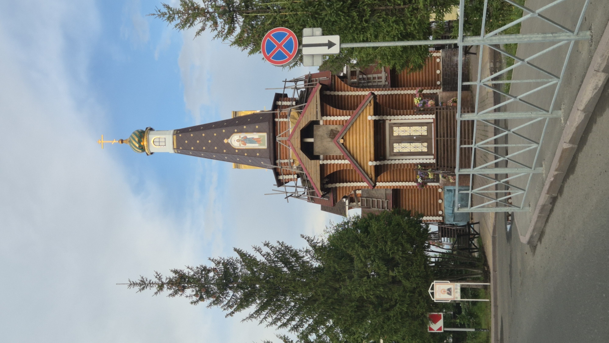 Wooden Orthodox church with green dome in Kemerovo, Russia