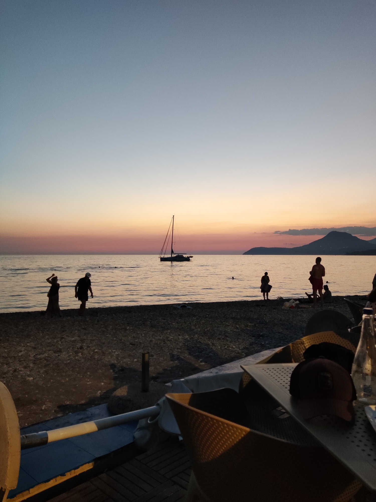 Dusk settles over Bar's beach with a soft mountain backdrop