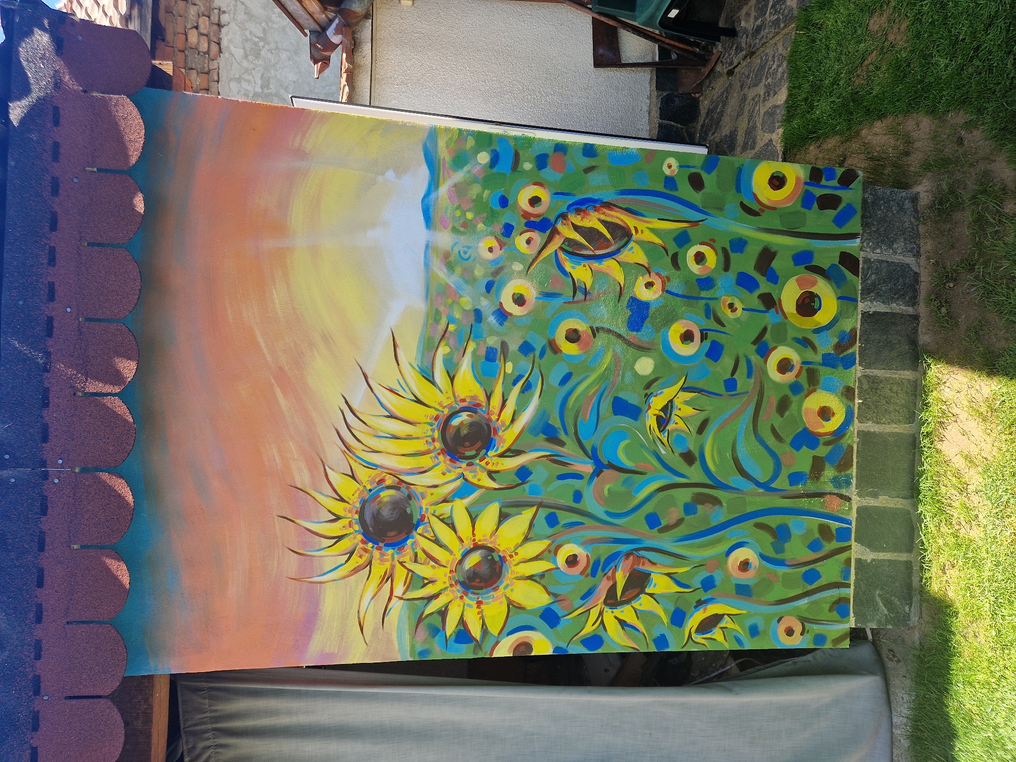 Sunflower oil painting spotted leaning against outdoor structure