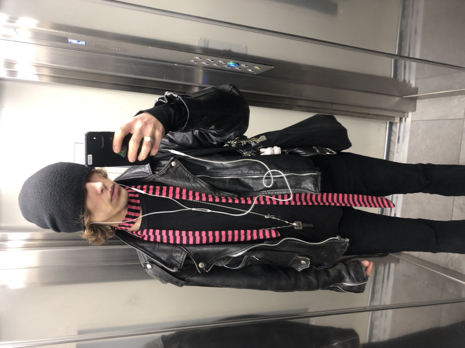 Person takes elevator selfie in Paris wearing black outfit