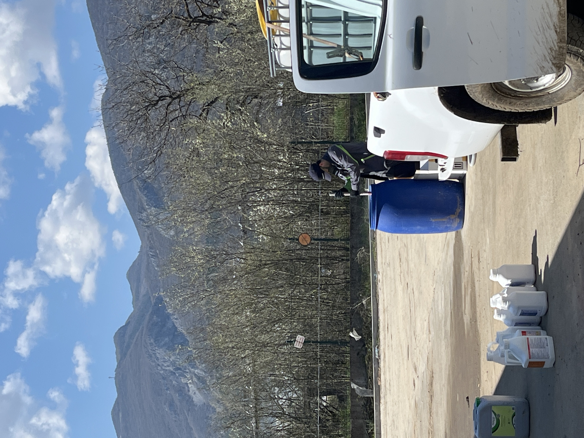 Worker transfers liquid from barrel to containers in Vratsa