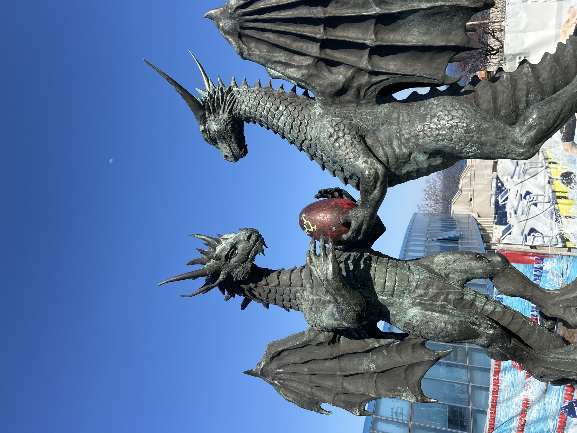 Bronze dragon sculpture with red globe observed in Varna