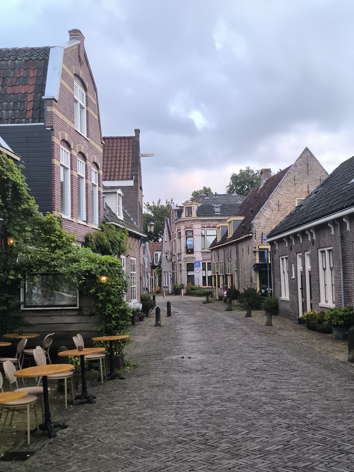 Evening stroll documented through rainy streets of Alkmaar, Netherlands