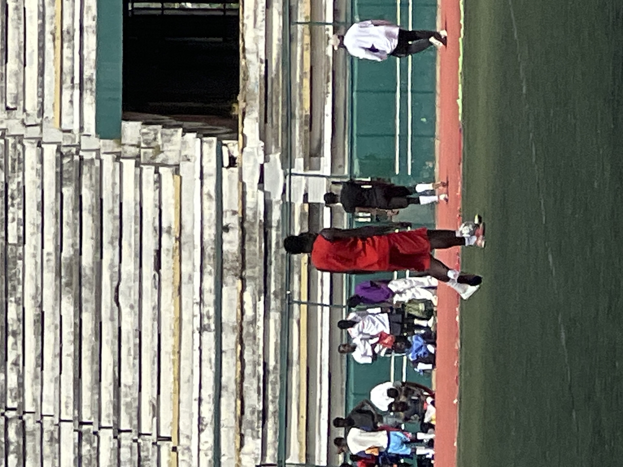 Football training session at a Nigerian stadium, mid-morning
