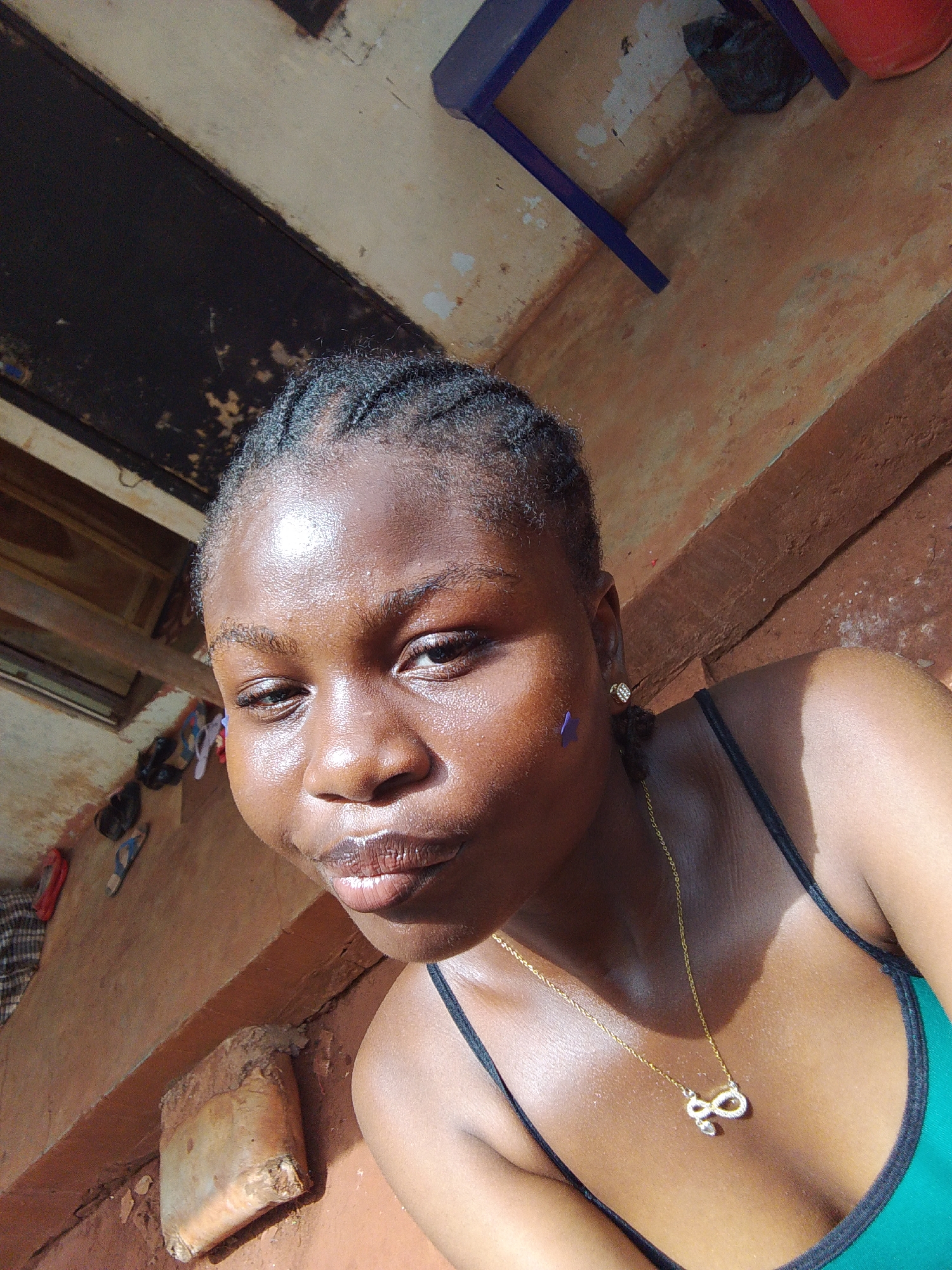Woman takes decorated selfies in Nsukka courtyard