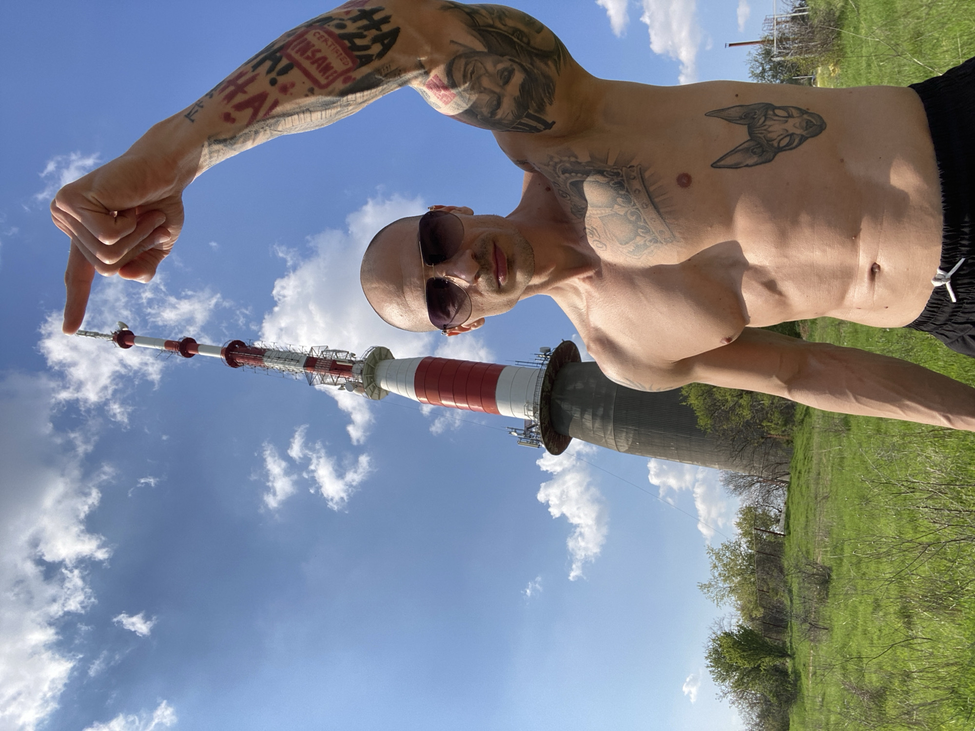 Man points at Pleven TV Tower in Bulgaria