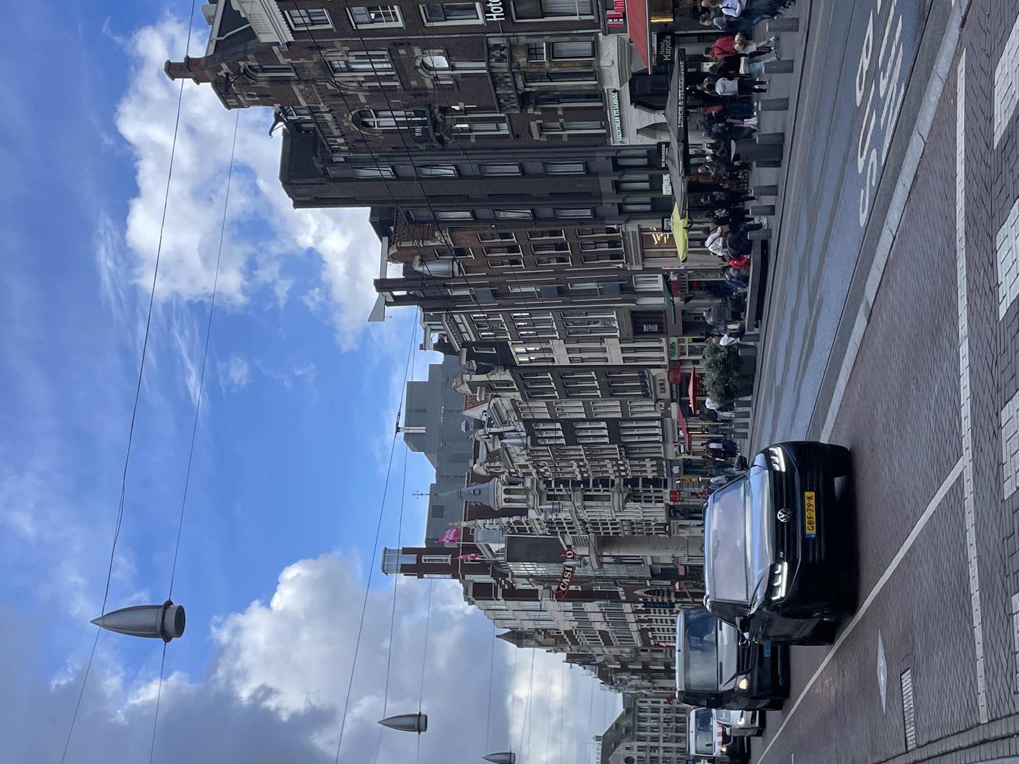 Swan family spotted in Amsterdam canals amid historic architecture