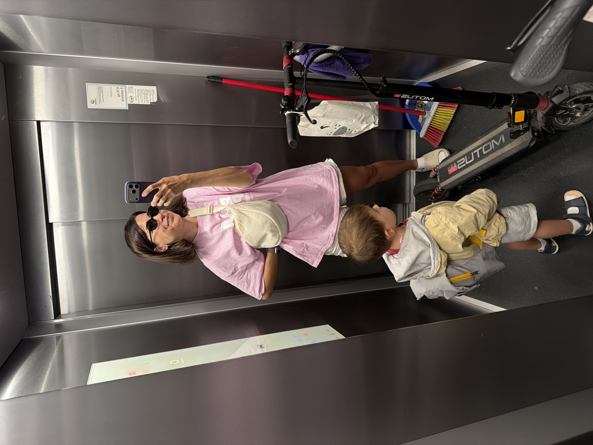 Woman, child photographed with scooter in Budva elevator