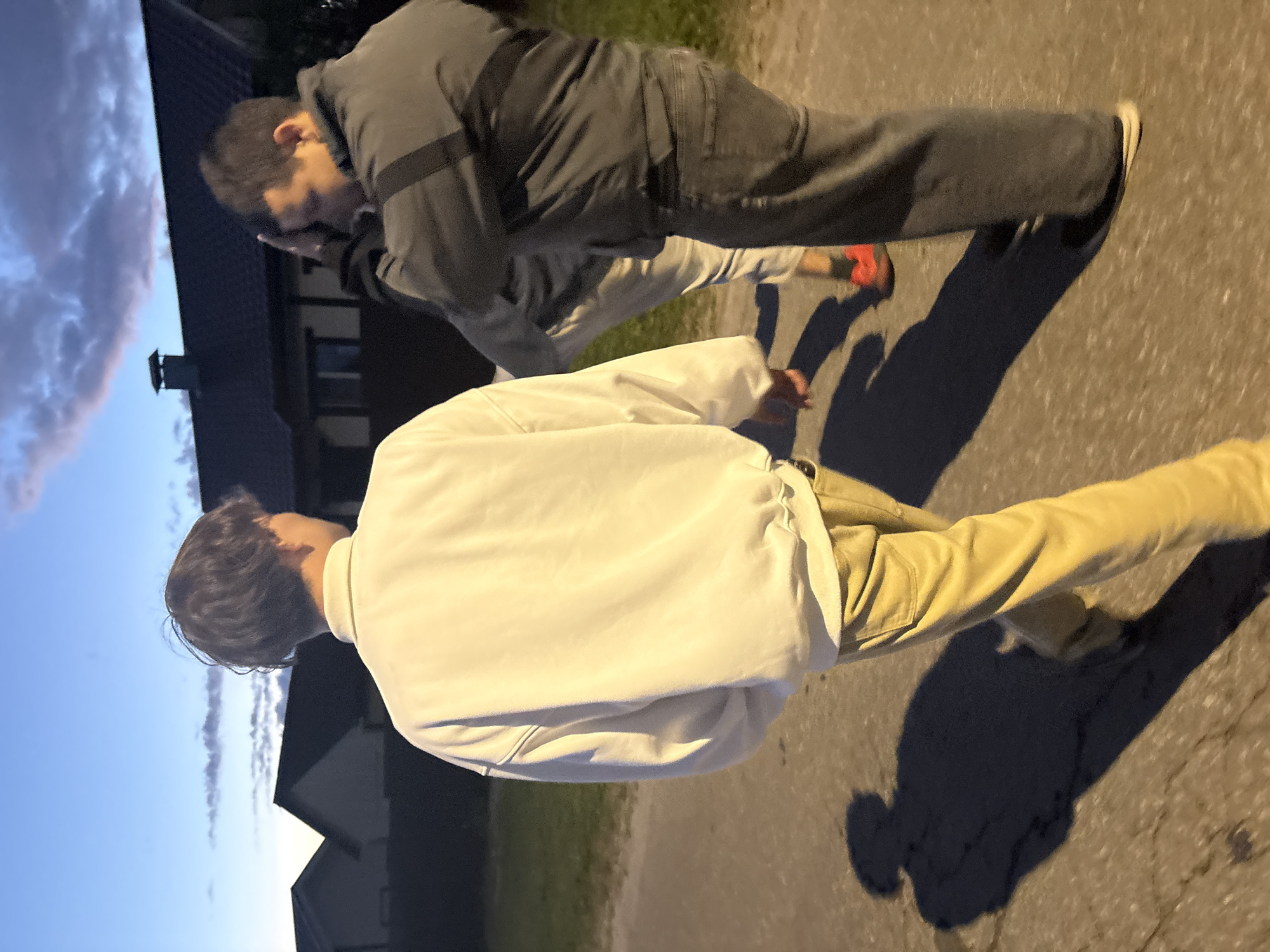 Evening walkers observed on residential streets during sunset hours
