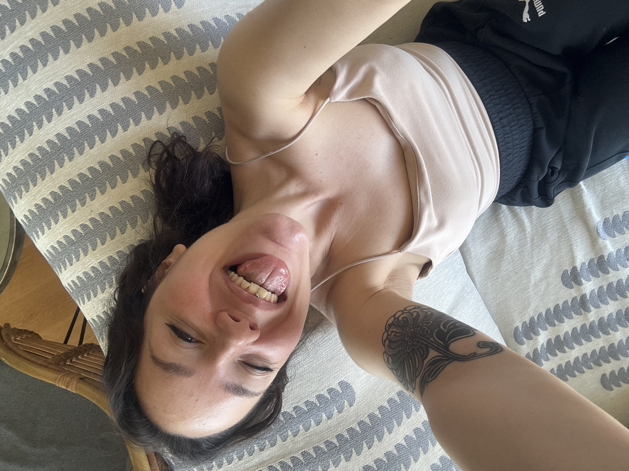 Woman poses playfully on cushion in Bulgarian town