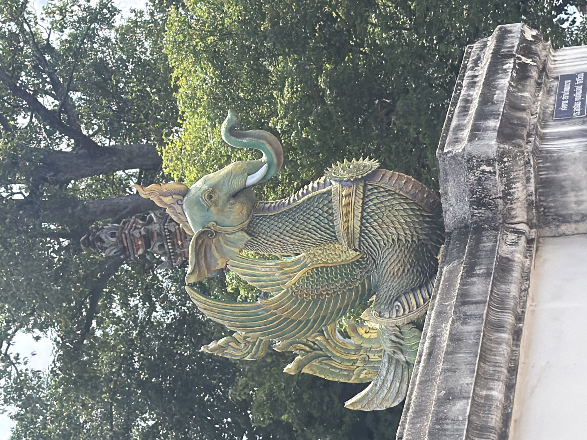 Ornate mythical sculptures at a Thai temple entrance in Ban Ko Klang