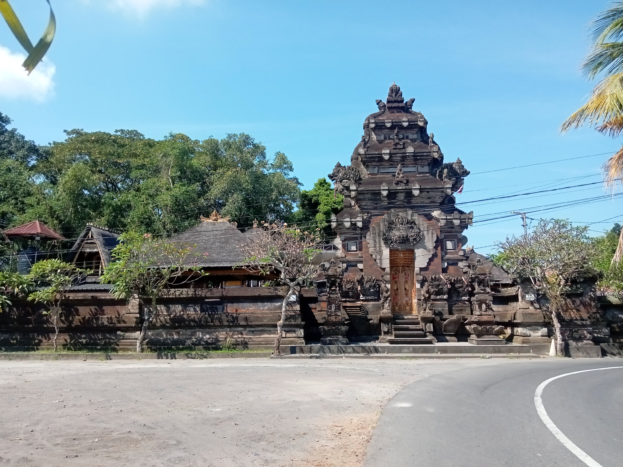Morning documentation of ornate Balinese temple gateway and grounds