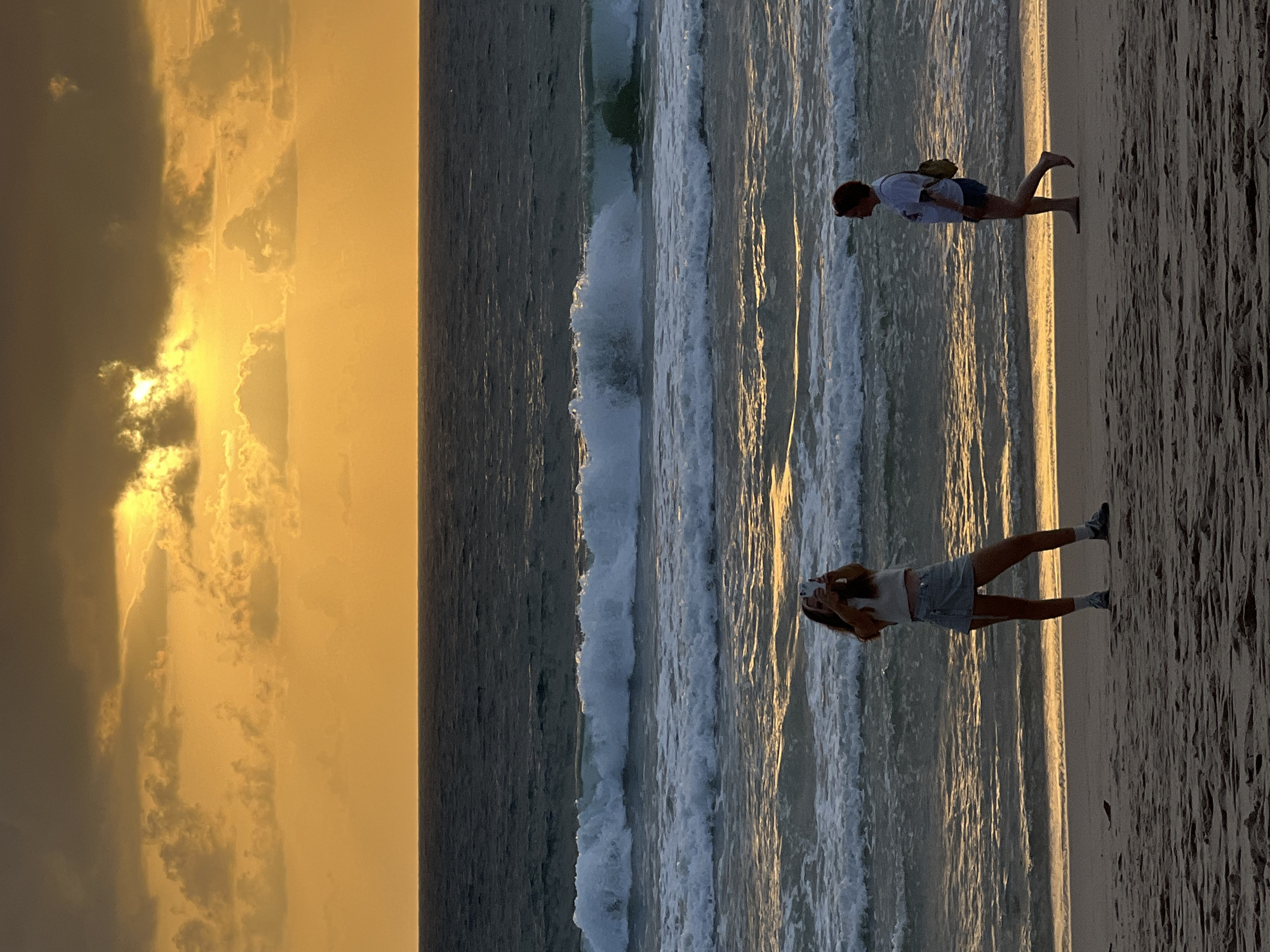 Sunset, storm clouds, and kites at Choeng Thale beach
