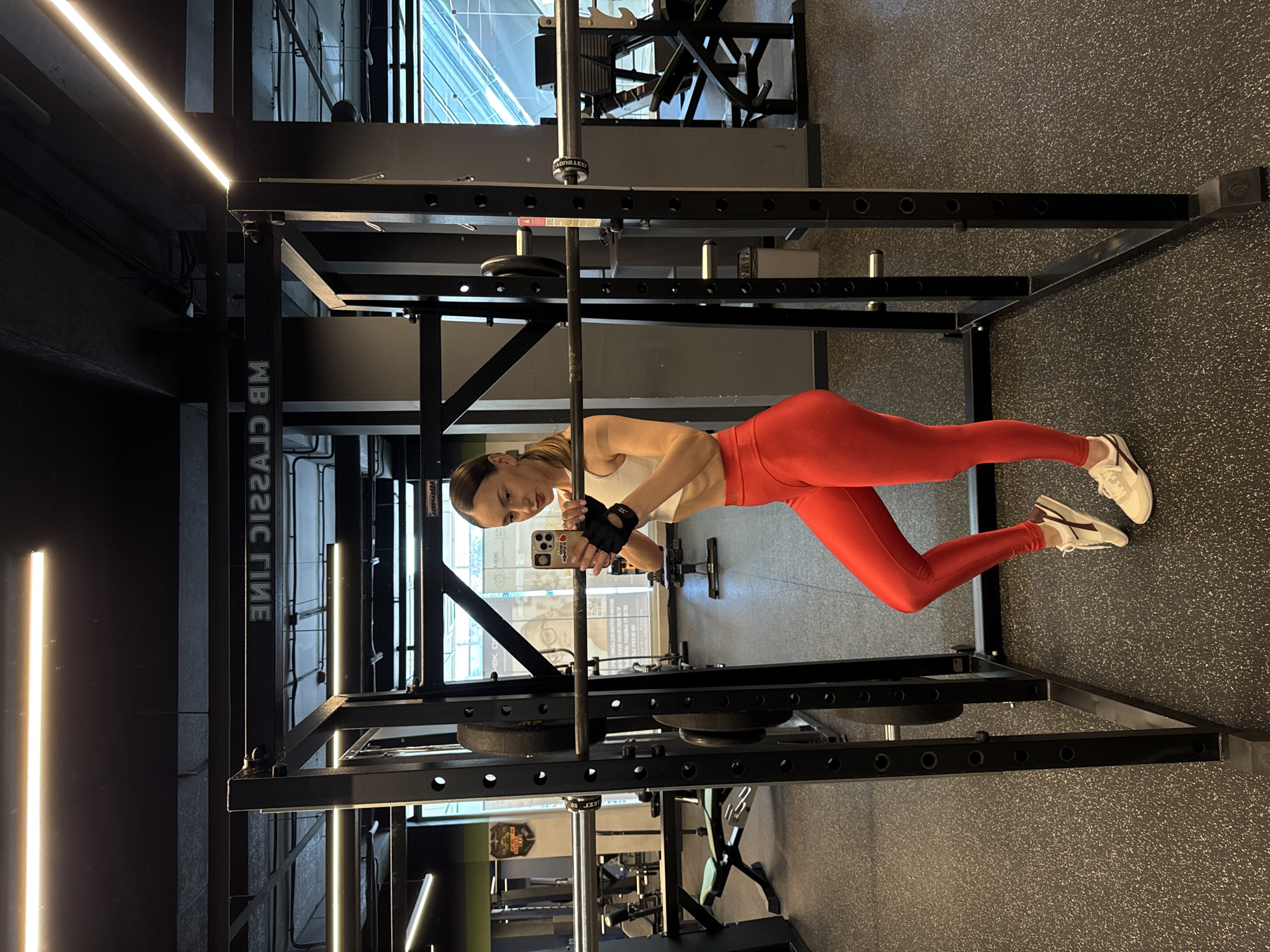 Woman documents gym workout session in Sochi fitness facility