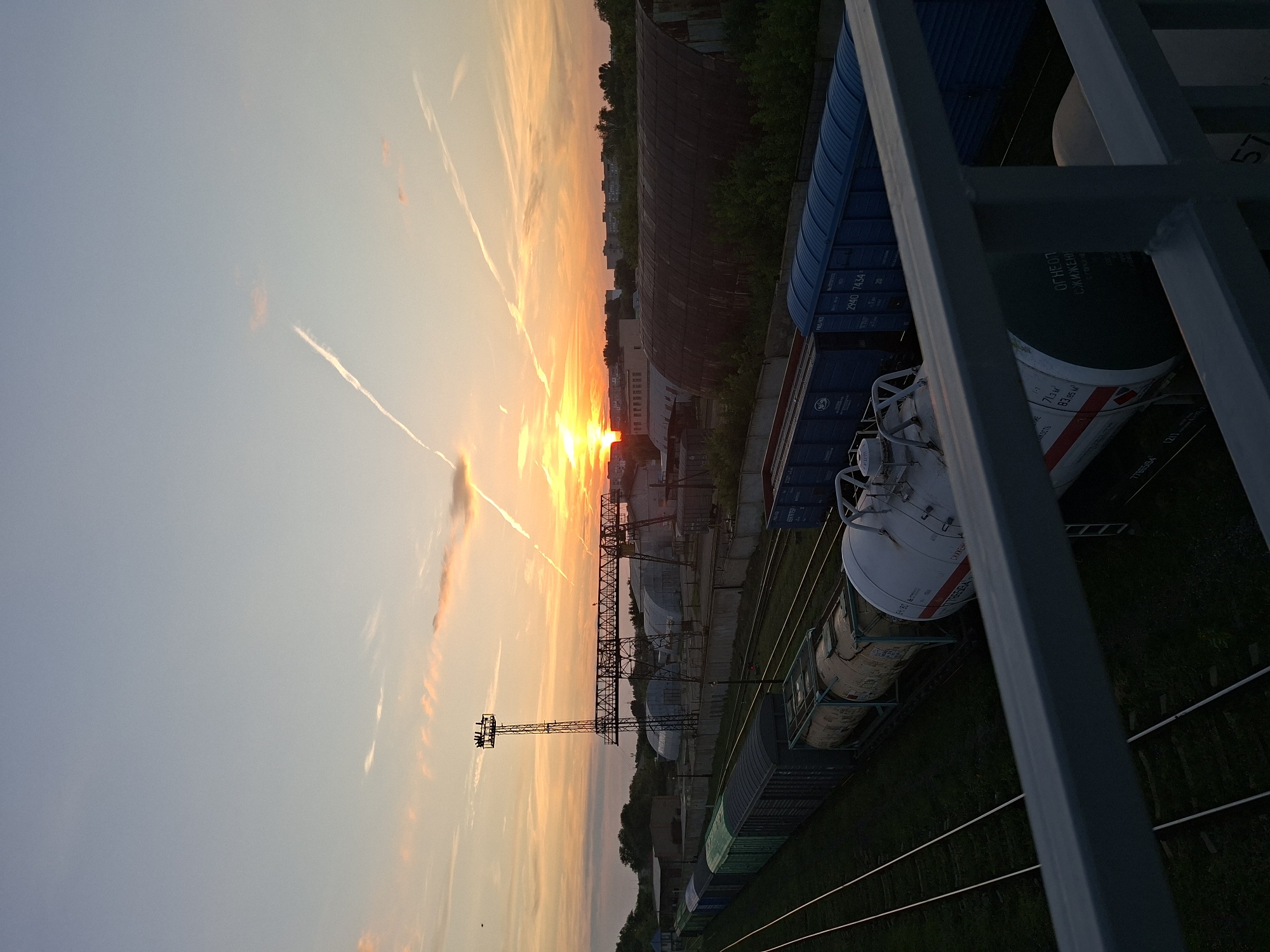 Sunset over Oral's freight yard, trains at rest