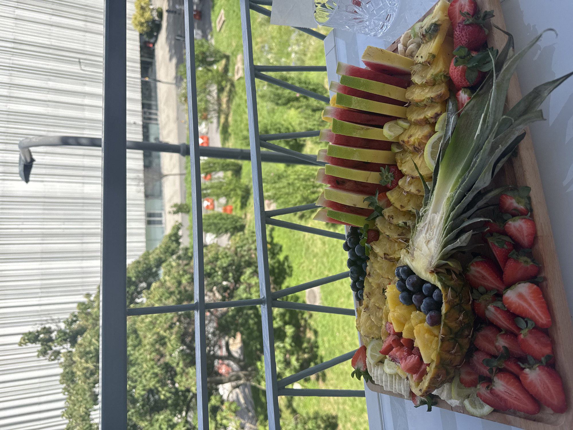 Fresh fruit platter arranged on wooden board in Milan