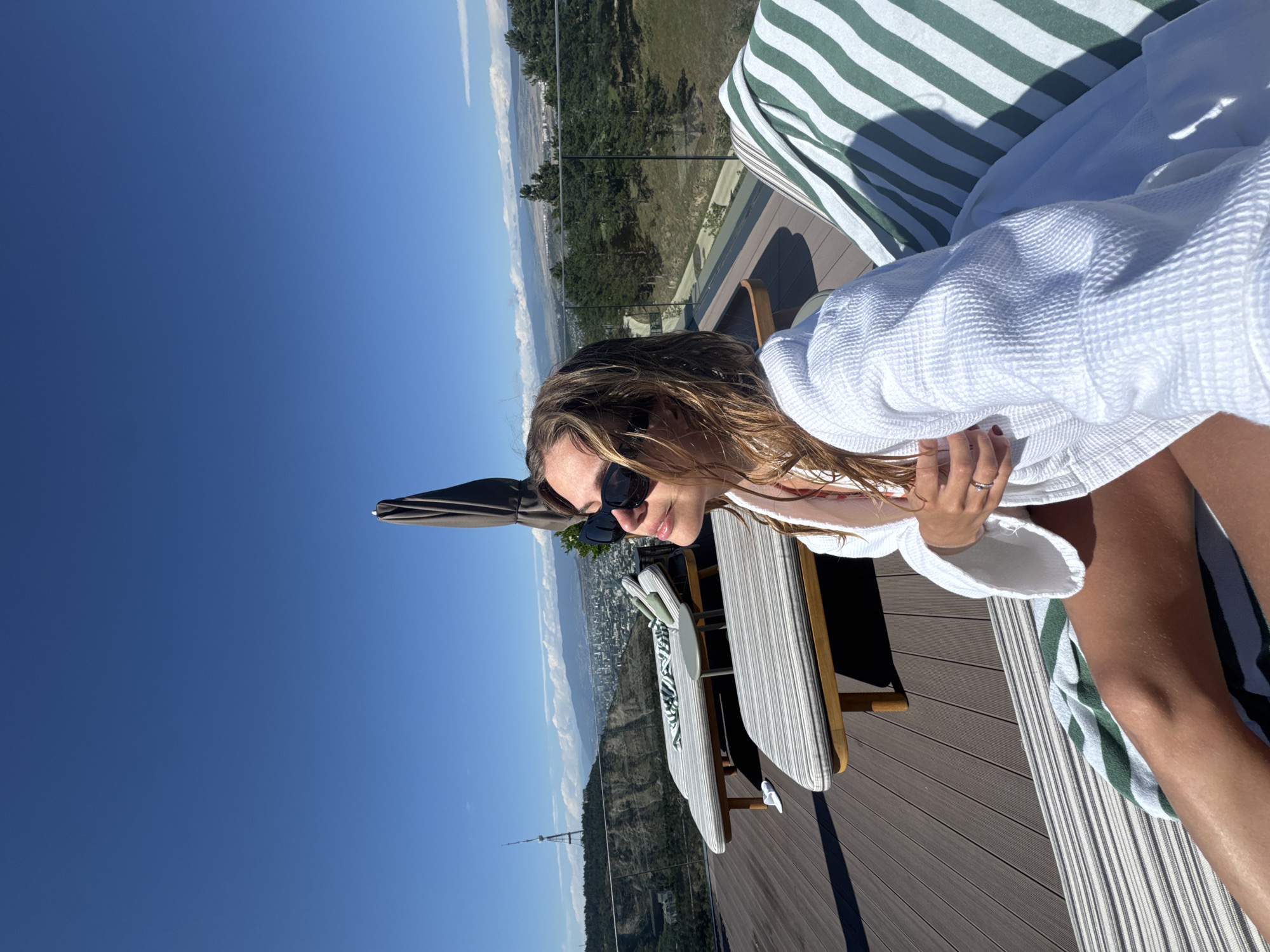 Poolside relaxation on a Tbilisi deck with city views
