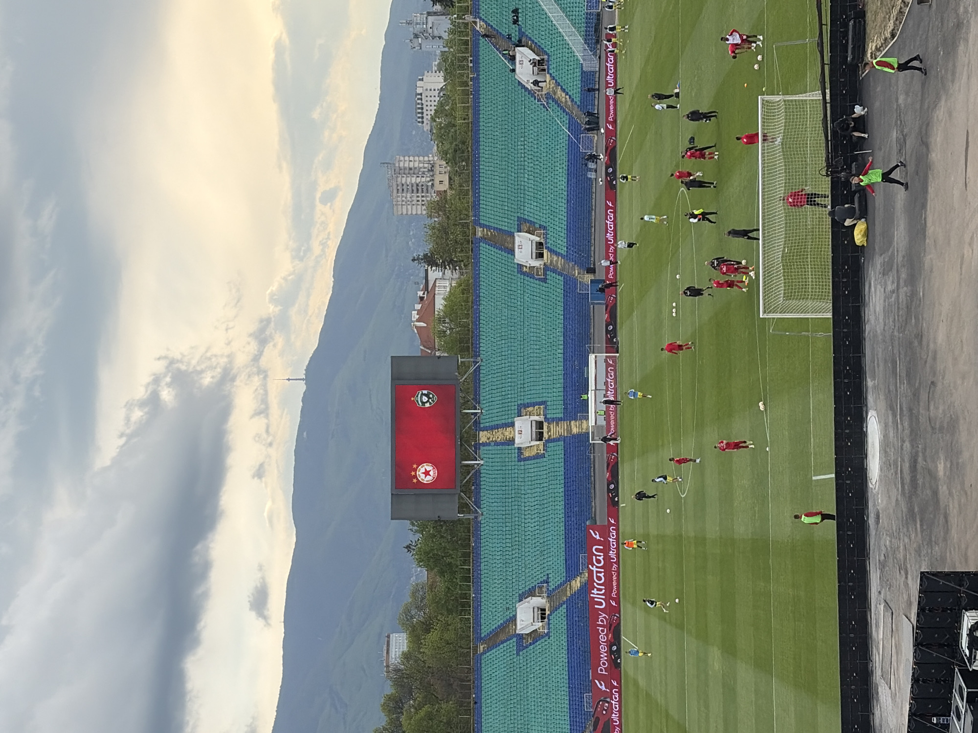 Football match draws crowds to Sofia stadium during golden hour
