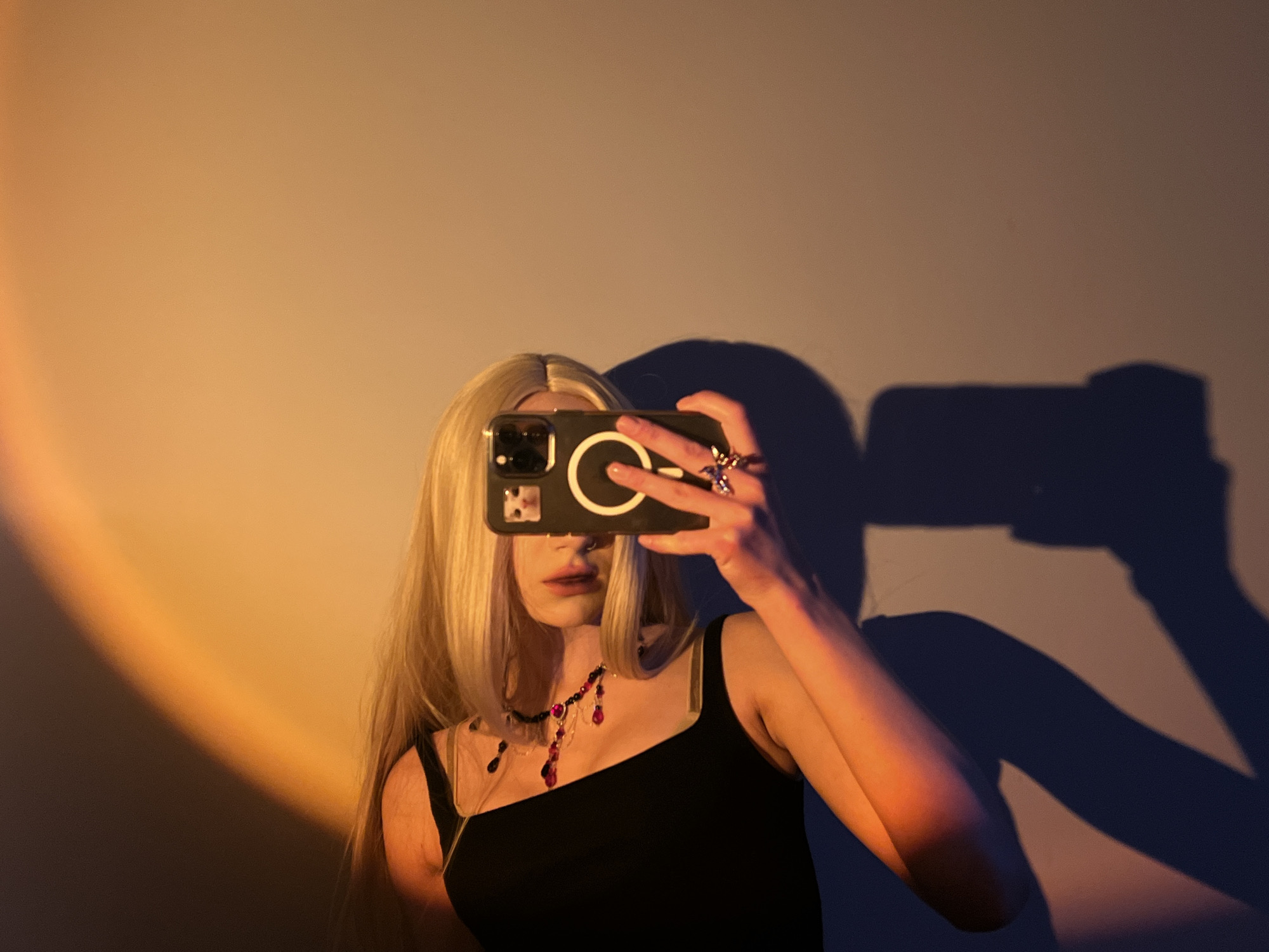Woman takes selfies, dog walked in Ternopil evening