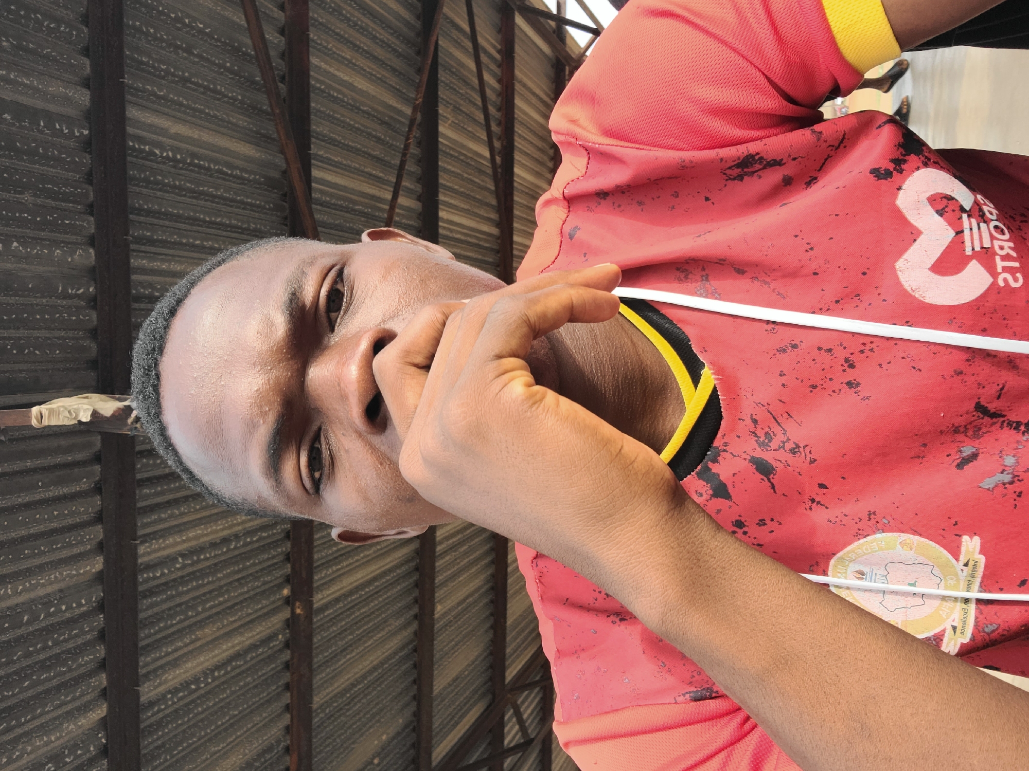 Young men gather after morning soccer in Jos, Nigeria