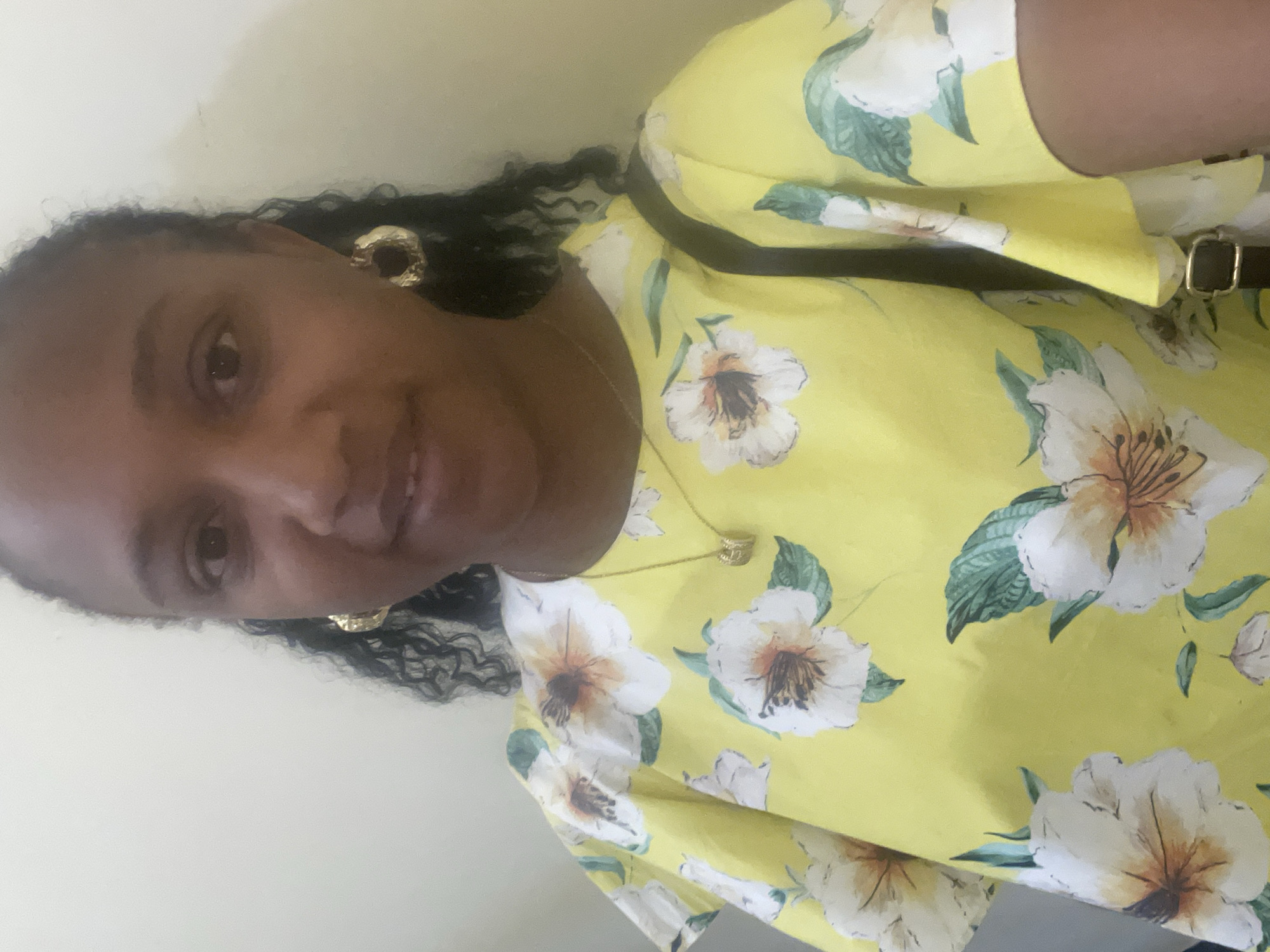 Woman in yellow floral top photographed in Jos
