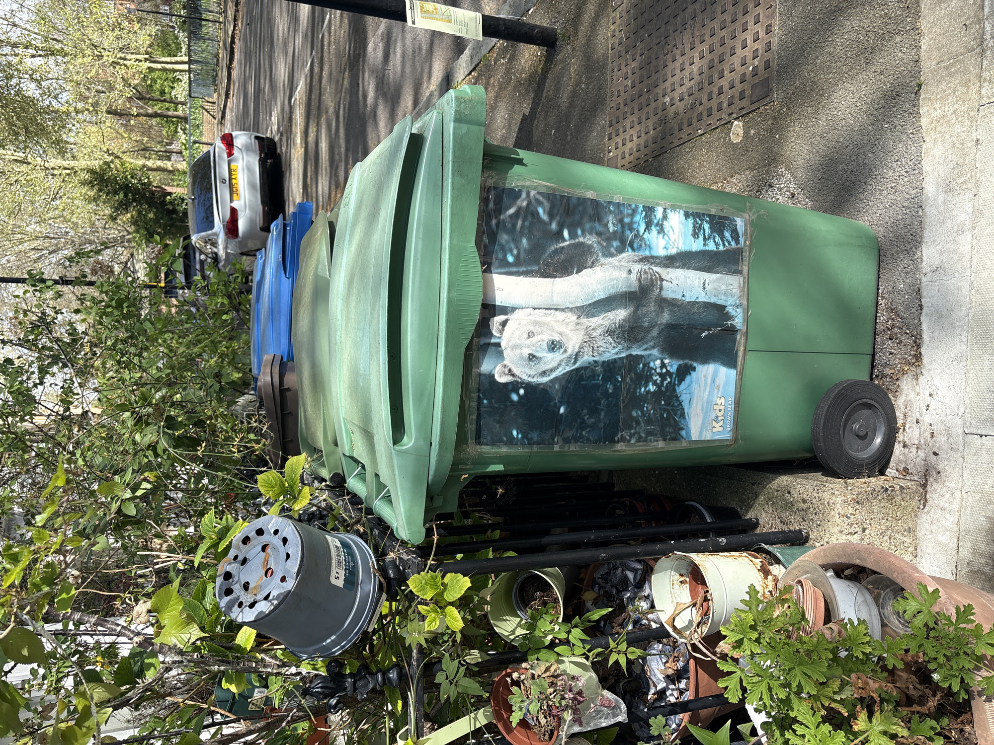 London residents document decorated bin and brick building