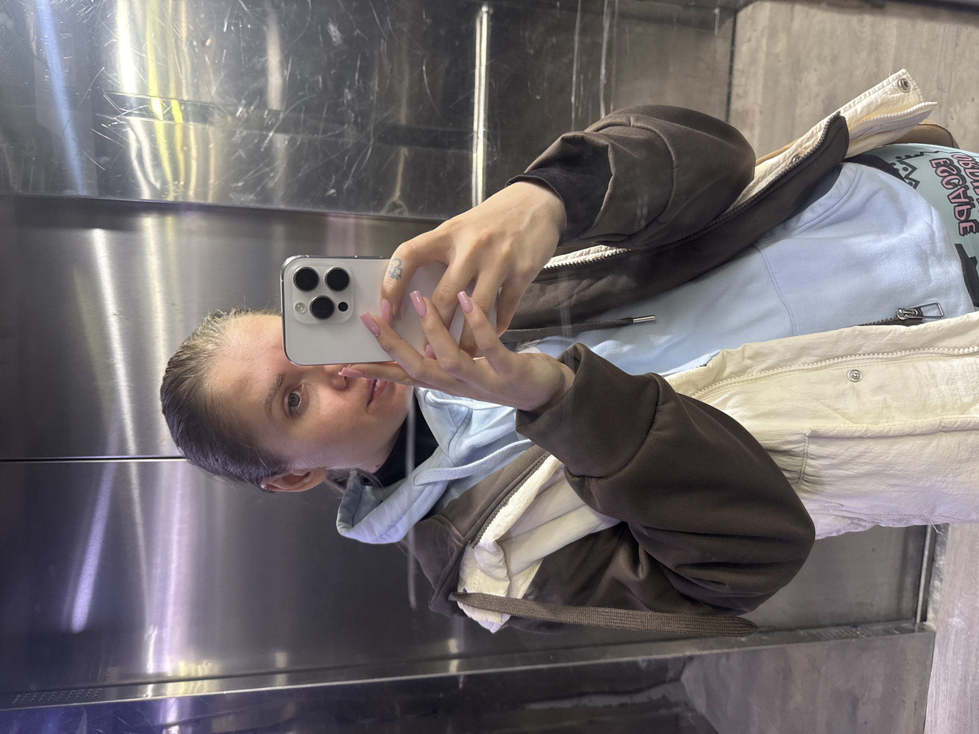 Woman takes elevator selfie in Batumi, Georgia
