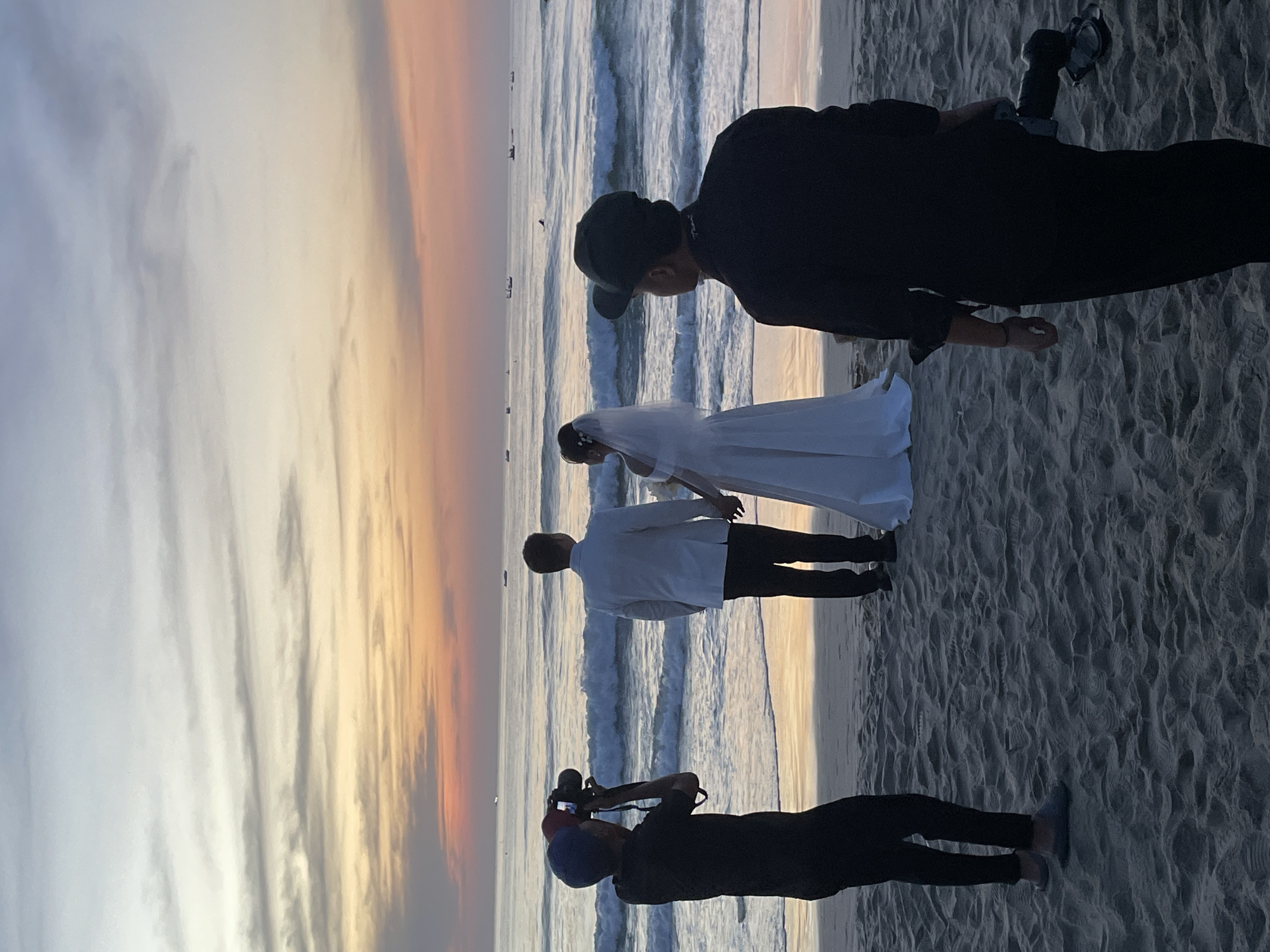 Wedding photoshoot on a Đà Nẵng beach at sunset