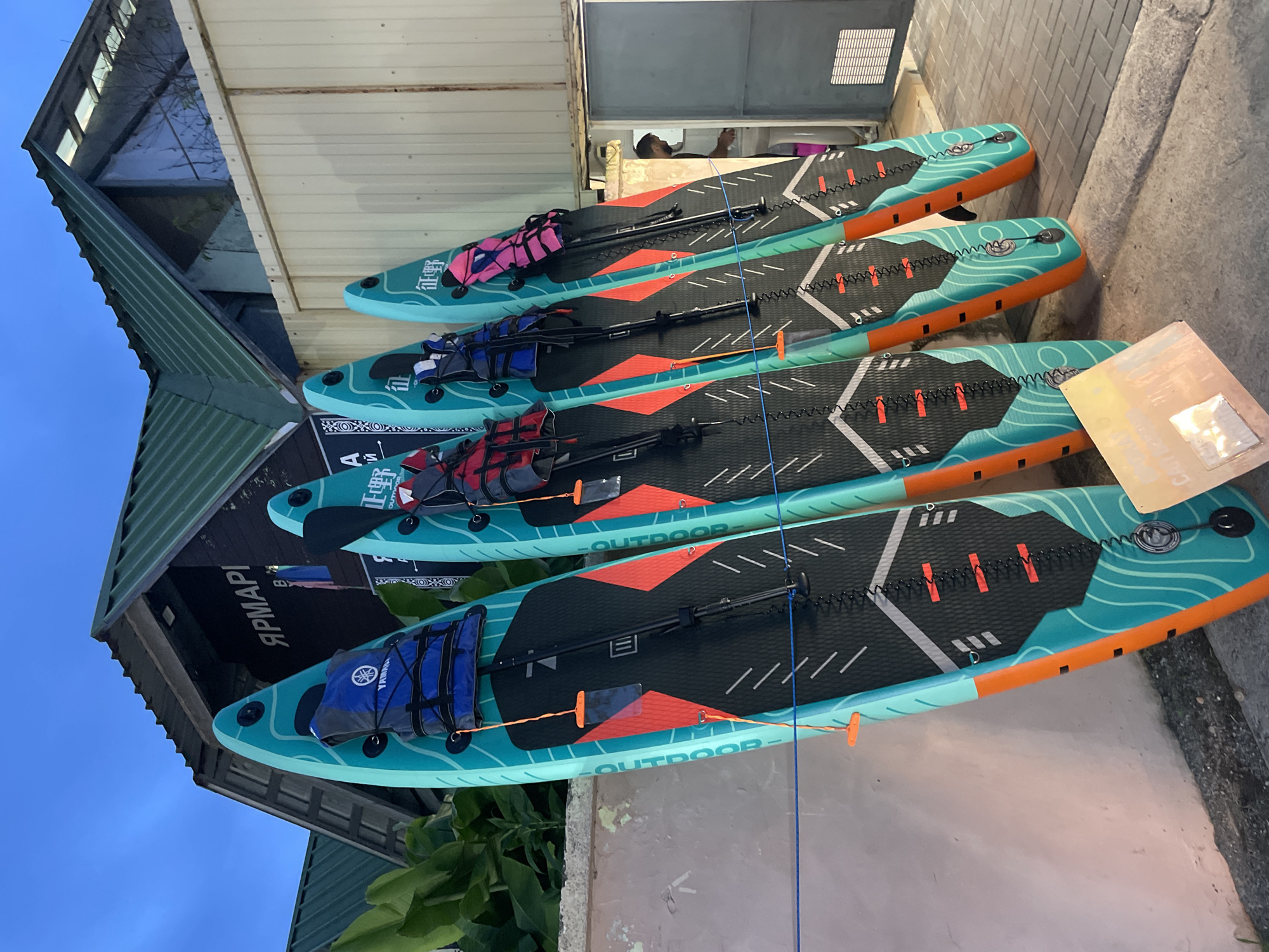 Summer water gear on display at a Khostinskiy outdoor vendor