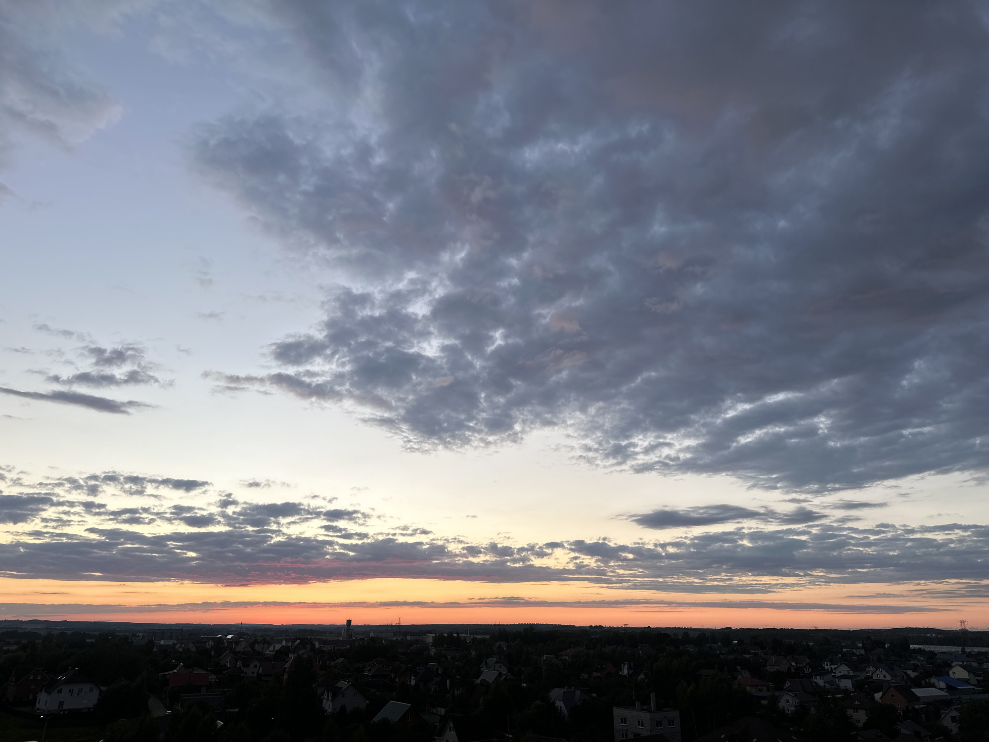 Dusk skies over a Belarusian suburb, late August evening