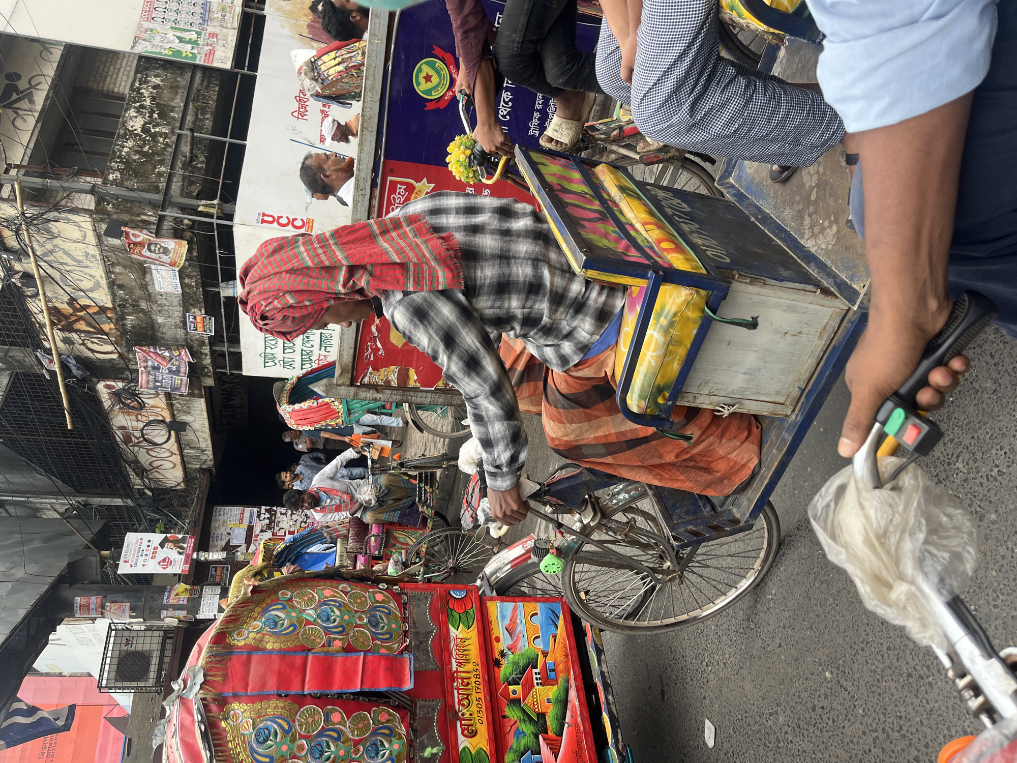 Rush hour rickshaw traffic documented in central Dhaka streets