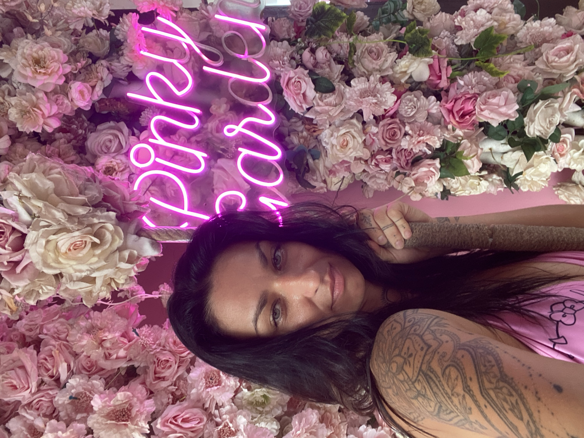 Woman photographs at pink-themed venue in Vietnam