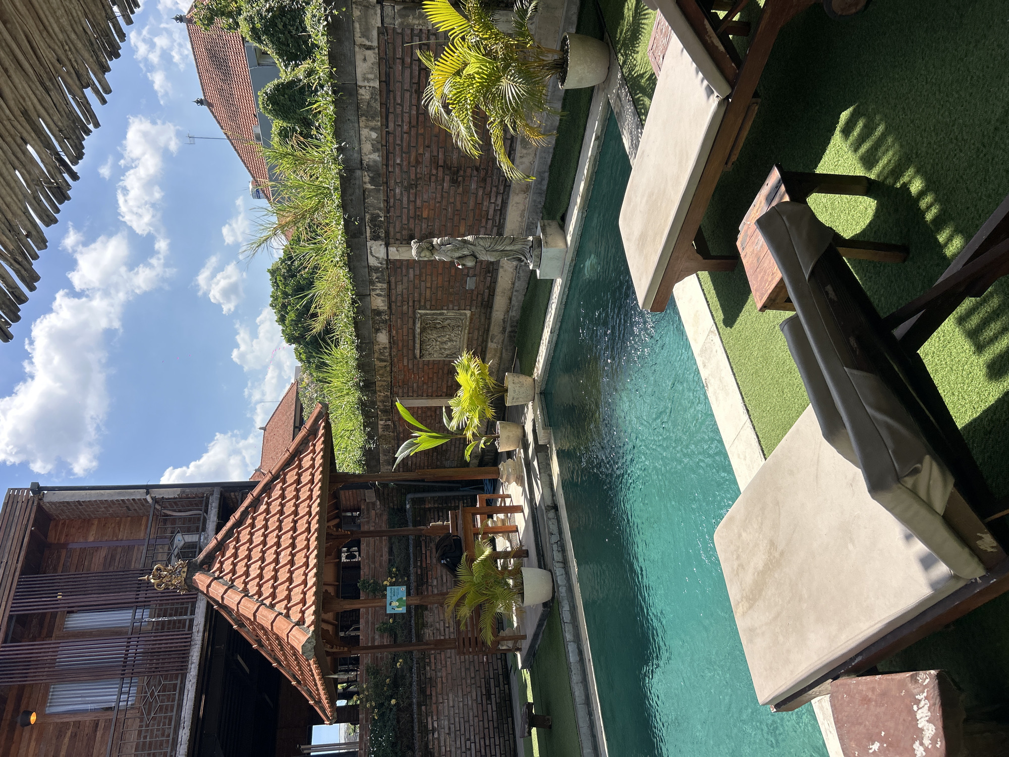 Resort pool, open-air gym, and Bali streets in North Kuta