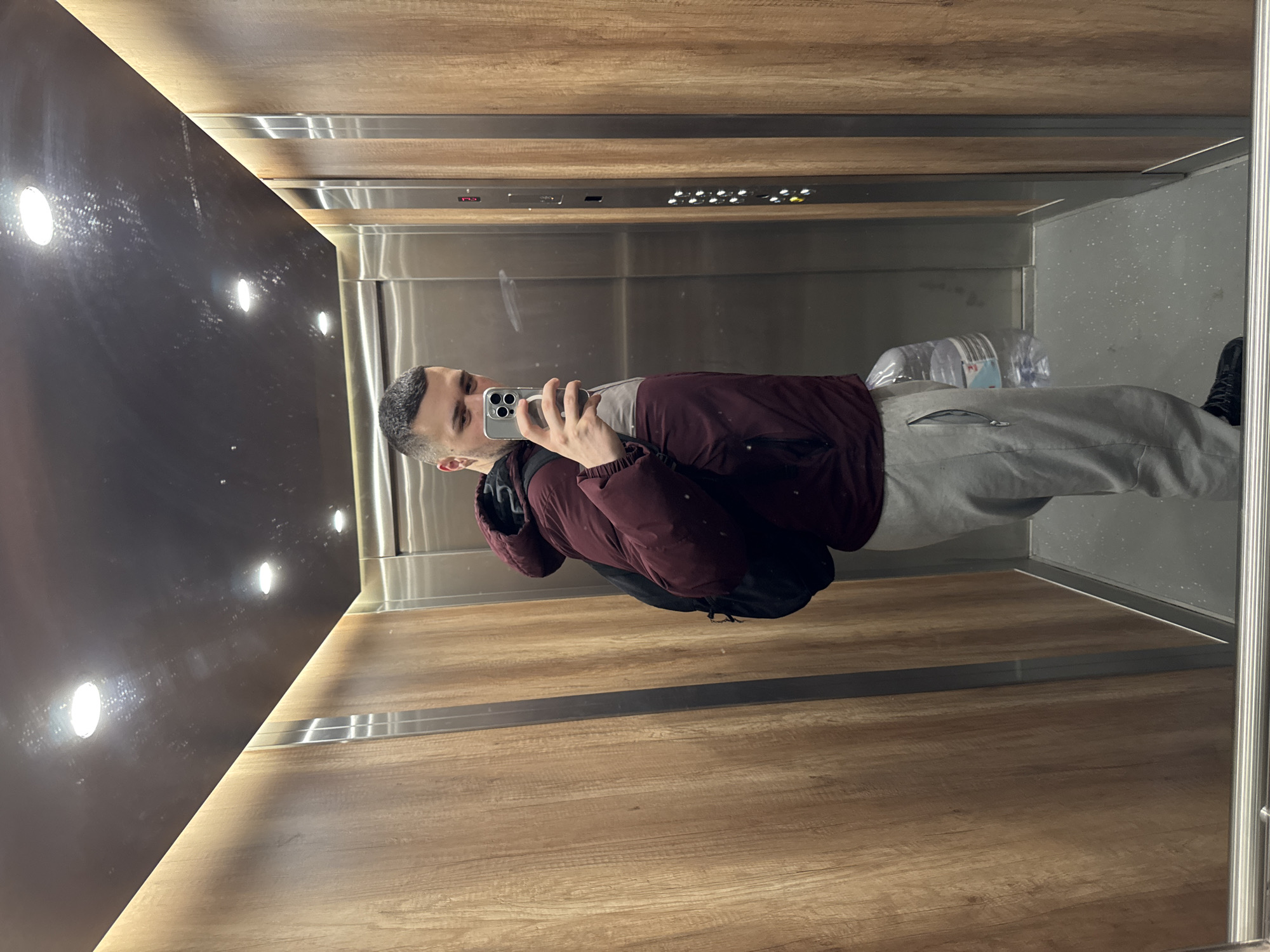 Man takes elevator selfie during overcast morning in Sofia