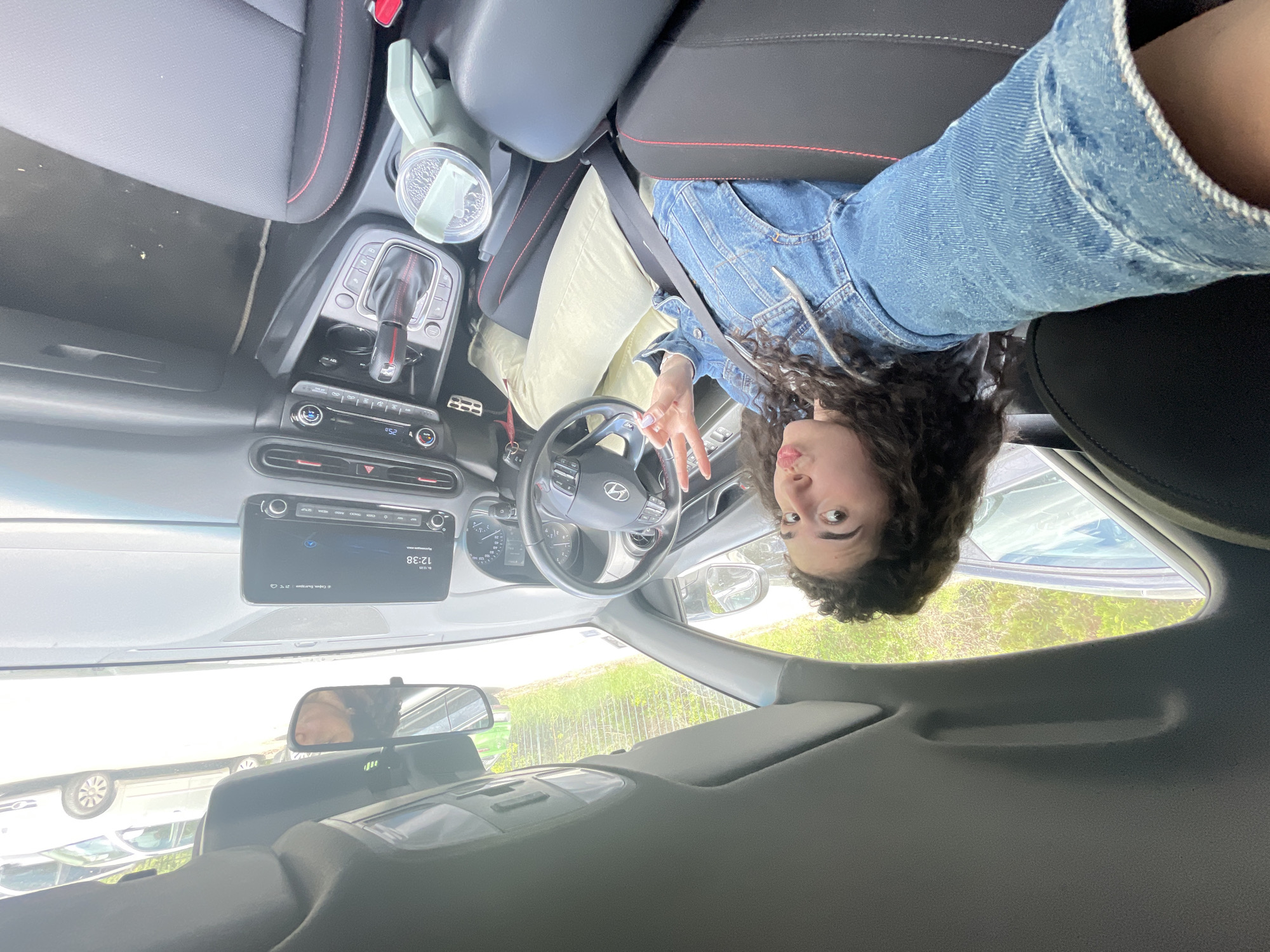 Woman takes selfies in car in Sofia Bulgaria