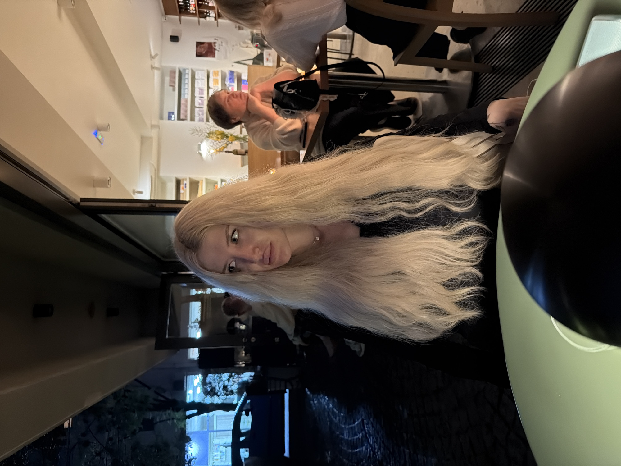 Woman dining at Belgrade restaurant captured in evening photos