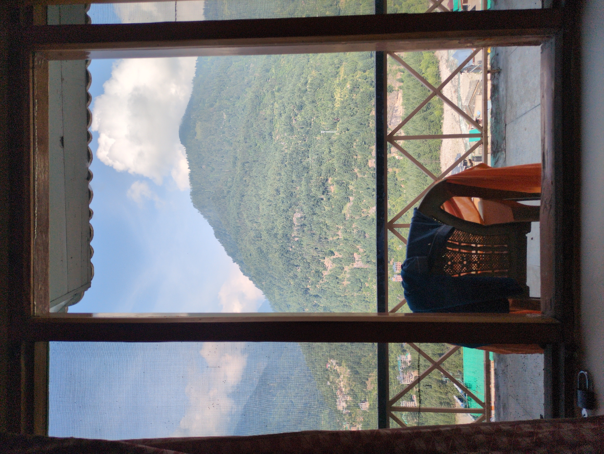 Vashisht village tucked into a Himalayan valley on a clear day