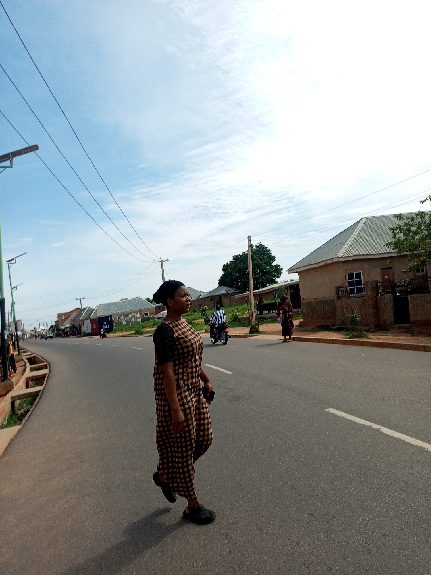 Morning street life along a road in Tempure, Nigeria