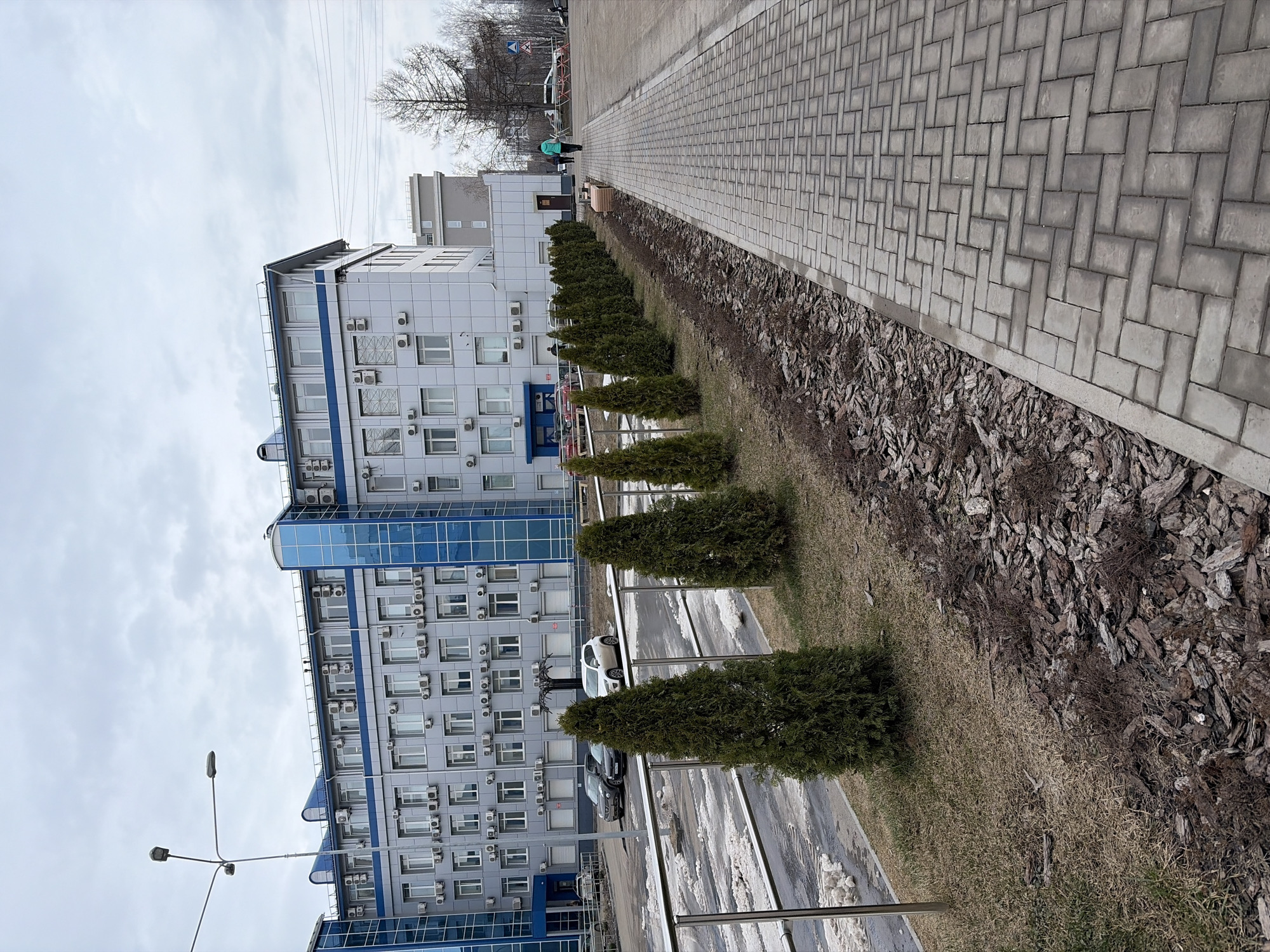 Early morning photo session near modern building in Izhevsk