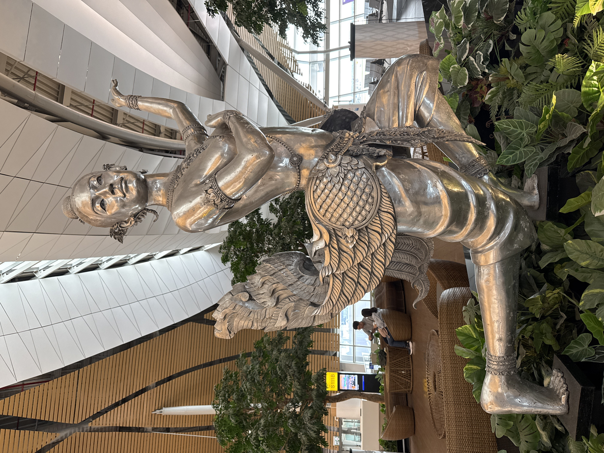 Late-night documentation of Suvarnabhumi Airport sculptures and operations