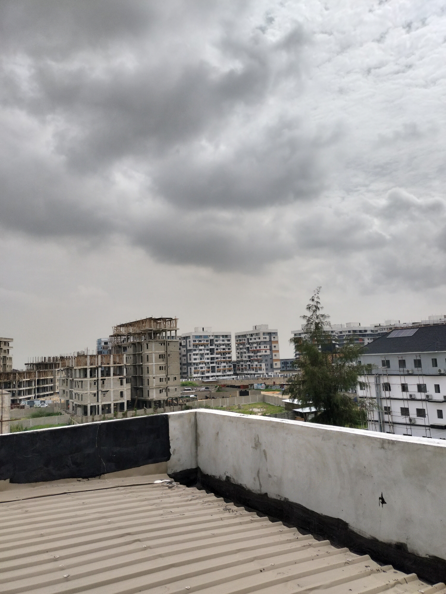 Morning rooftop views document everyday Moba, Nigeria street scenes