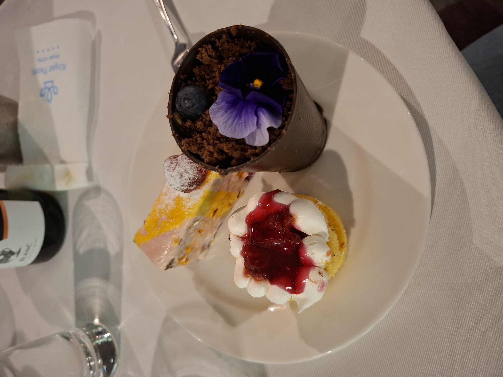 Three desserts plated at dining establishment in Pavel Banya